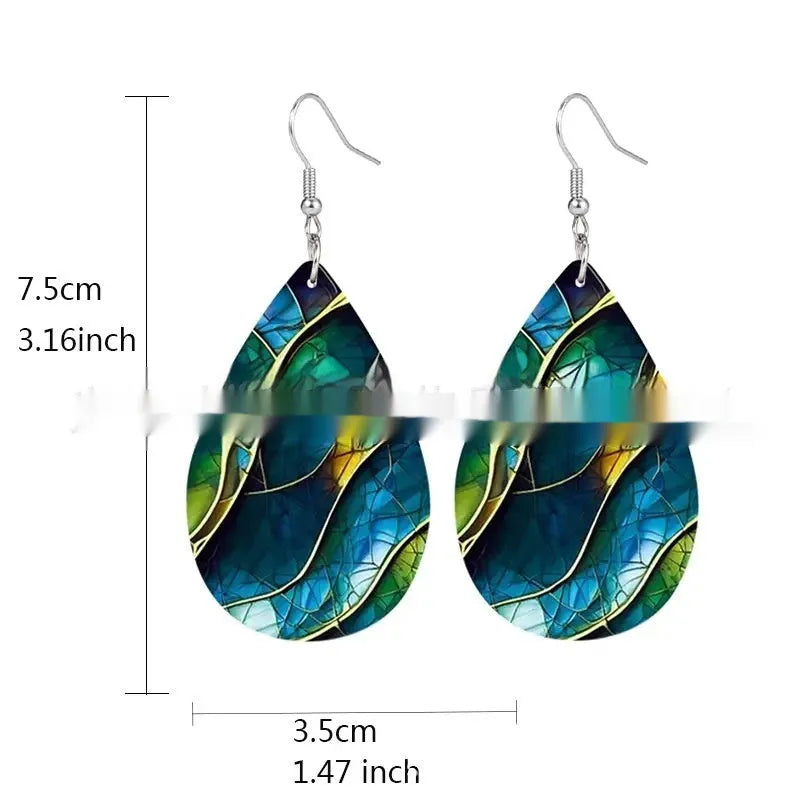 Printed acrylic drop earrings with flat branch knot geometric design on white background