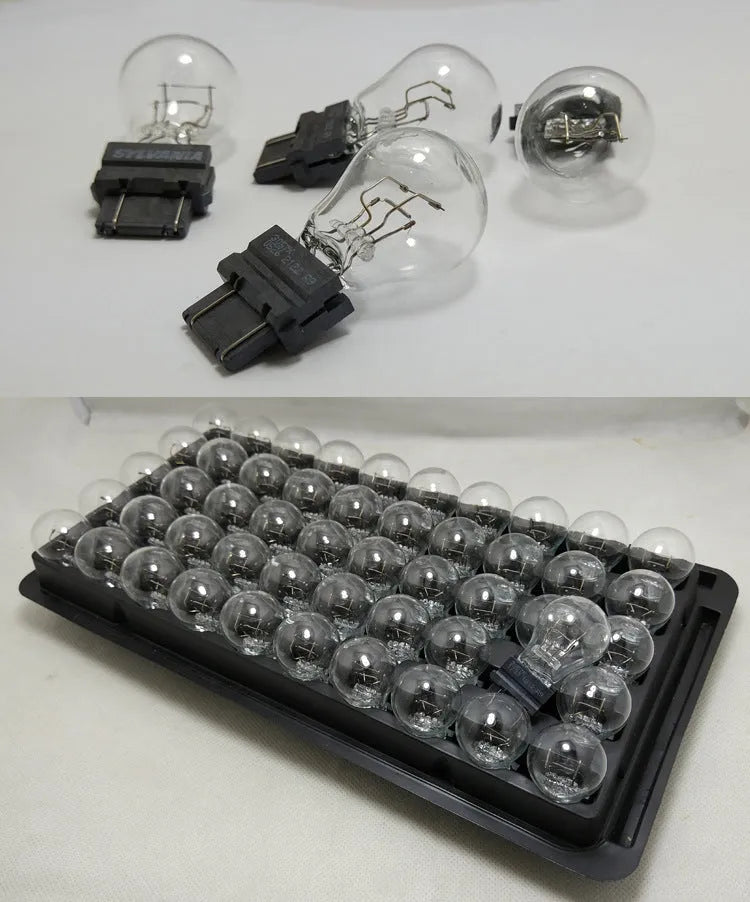 Wagner brake light bulb with dual wire design showing plastic alignment dots and 16mm socket