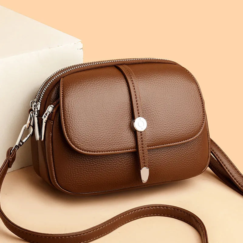 City Simple women's oval crossbody shoulder bag in soft PU leather with sewing thread details