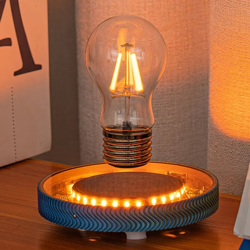 Small magnetic suspension moon night lamp with 3D-printed design on a shelf.