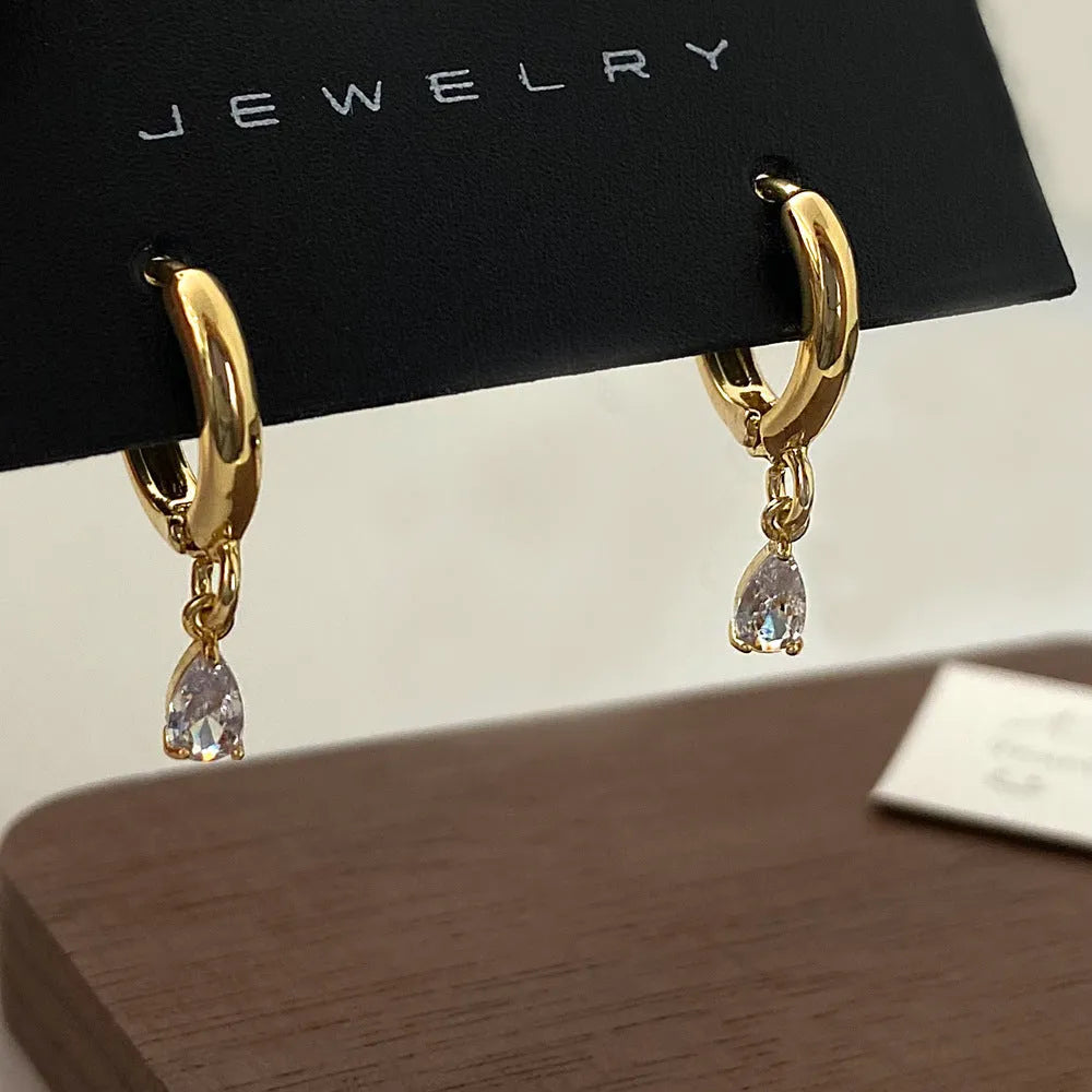 Zircon necklace, earrings, and anklet set with geometric meteor shower design.