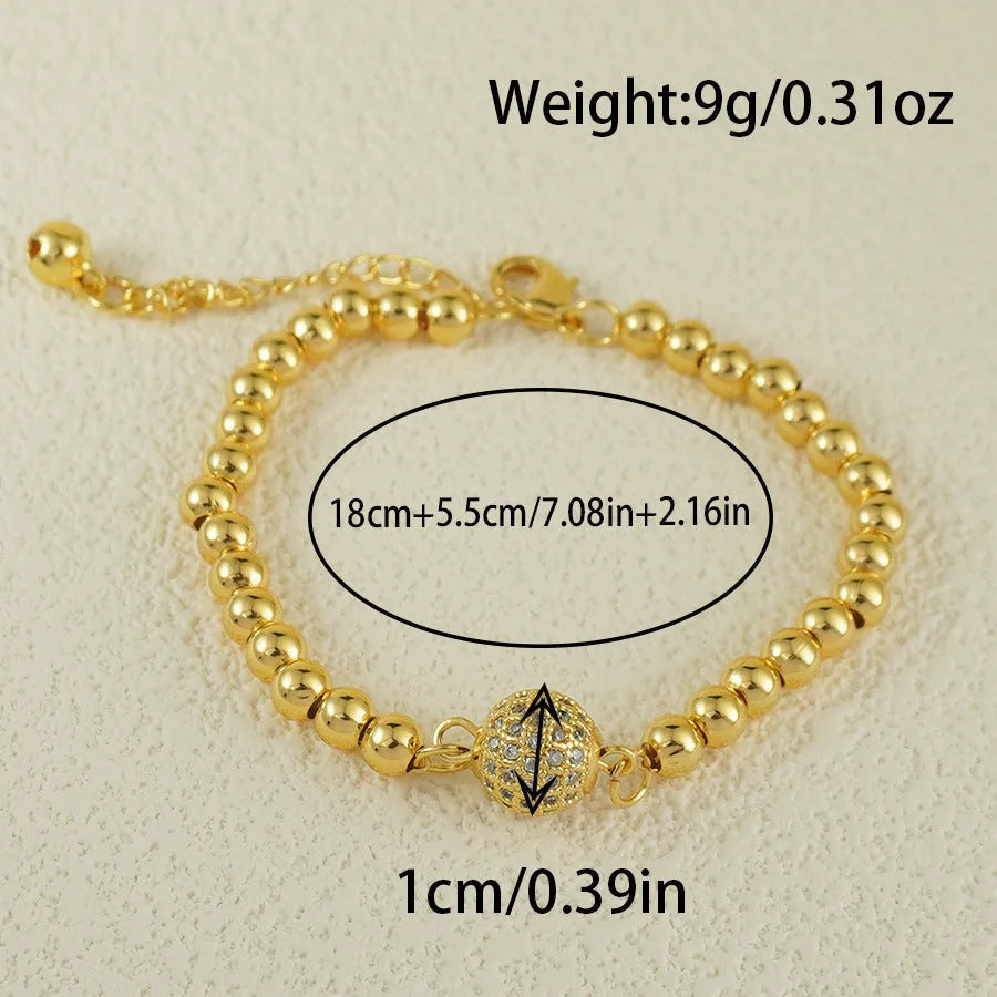 Arabic-style women's copper bracelet with a heart-shaped zircon ornament on a model's wrist.