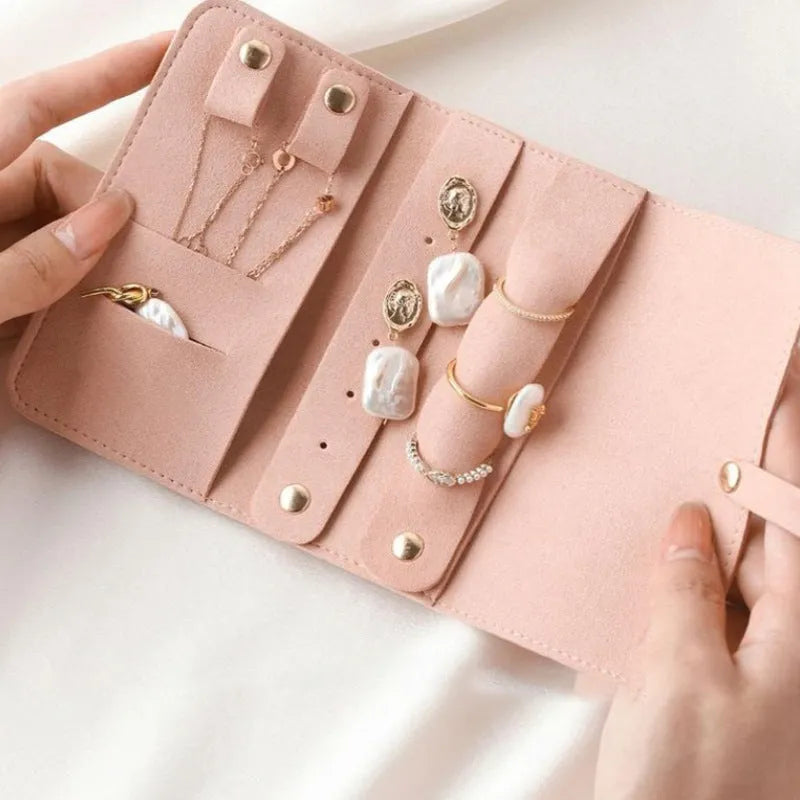 Brown soft microfiber PU leather jewelry storage bag measuring 12x12 cm for earrings and watches.