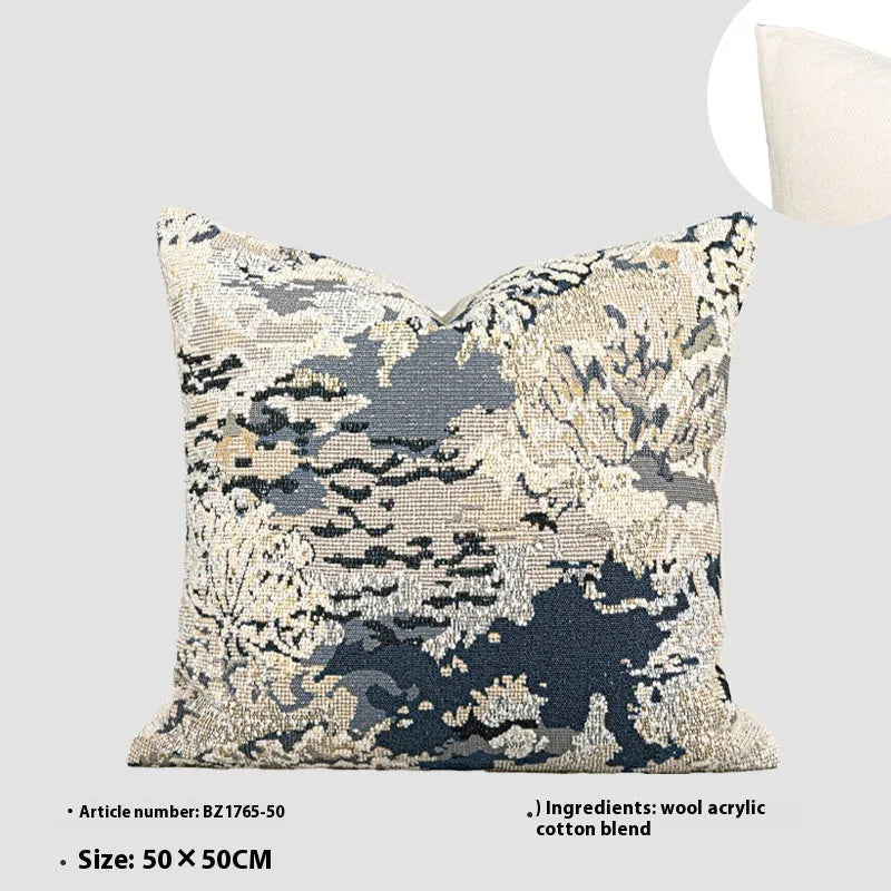 Antique blue wool blend decorative pillow with abstract flower pattern in square and waist pillow sizes.