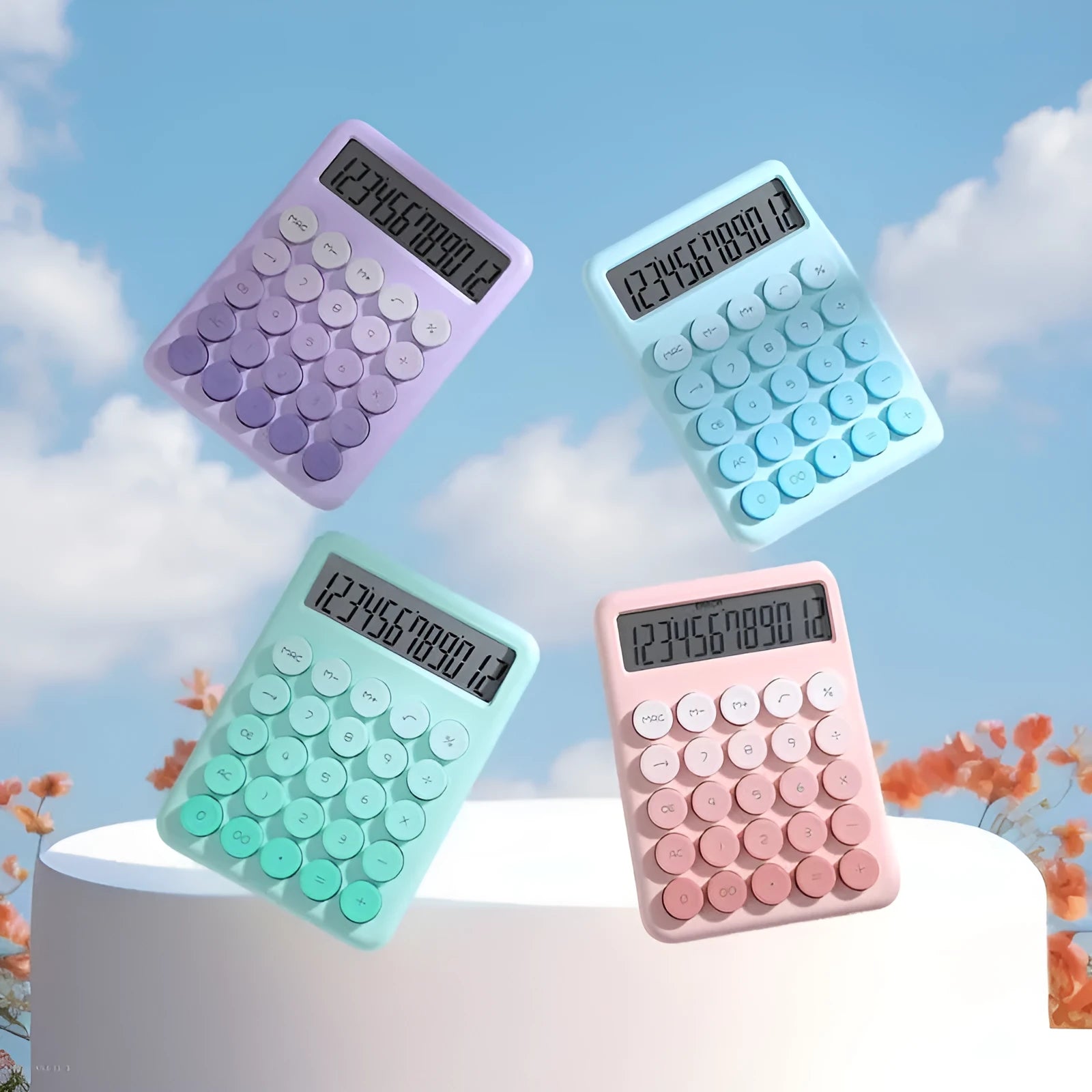 Desktop calculator with gradient colour finish in violet, cherry blossom pink, glacier blue, or mint green on a desk.