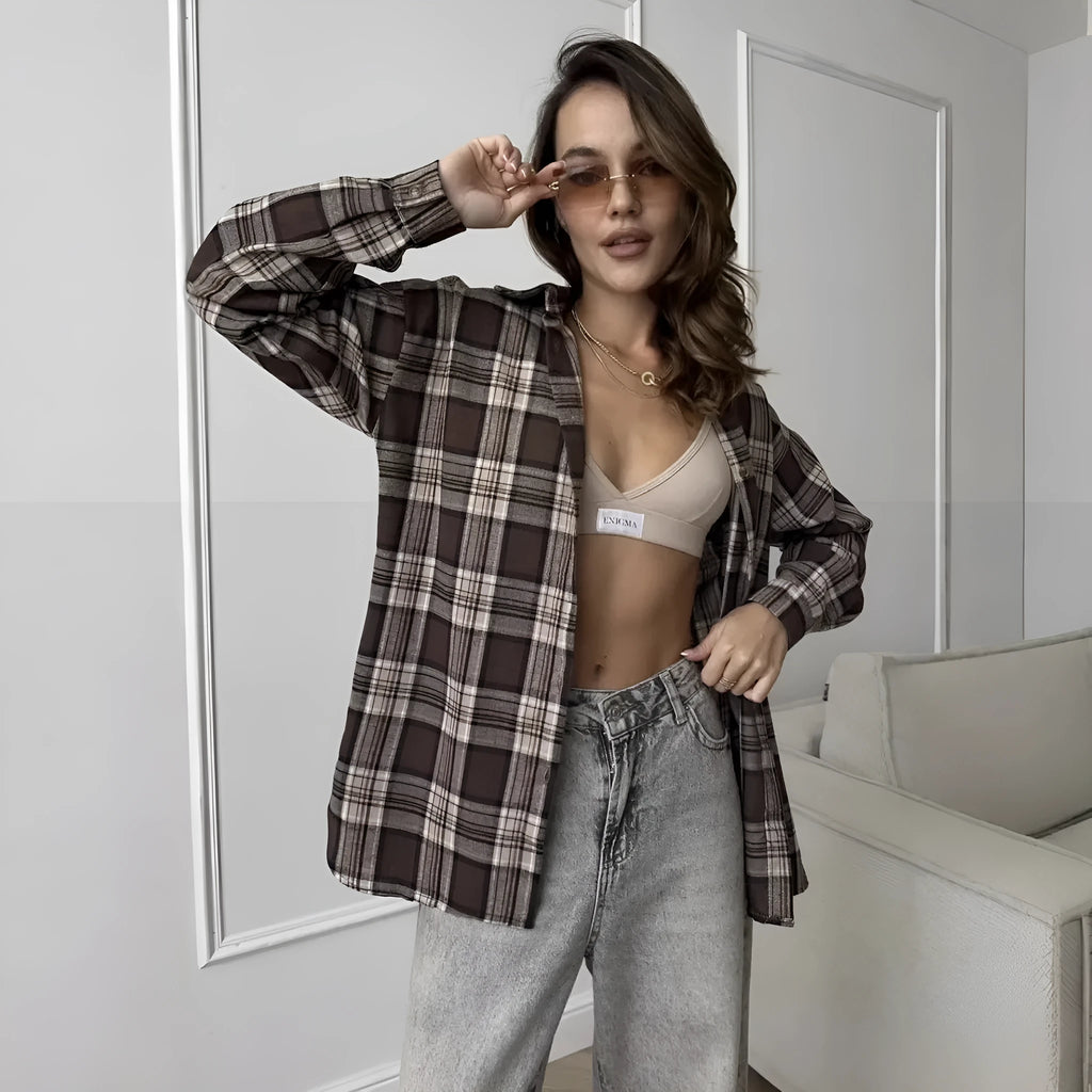 Dark brown striped long sleeve women's shirt with retro style collar on a hanger.