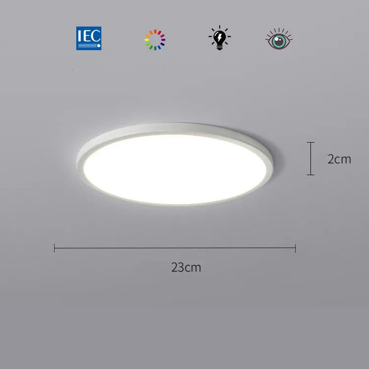 Ultra-thin round white LED ceiling lamp with aluminium frame and acrylic shade on ceiling