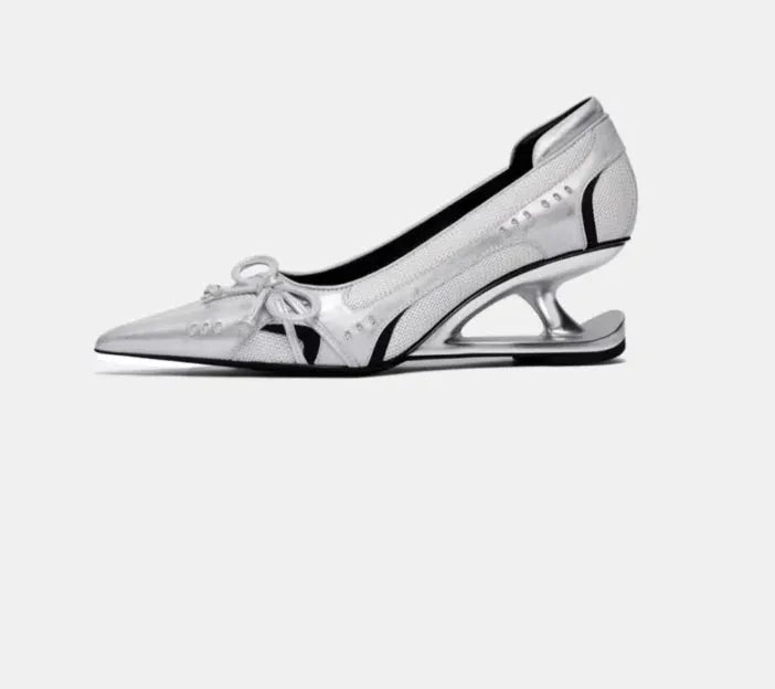 Black women's pointed toe Mary Jane shoes with a floating heel and slip-on design.