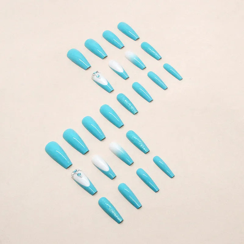 Long ballet shaped press-on nails with solid blue diamond glitter colour.