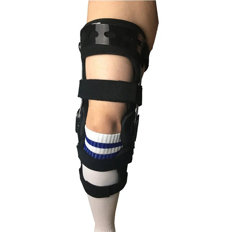 Black anterior ligament knee supporter with structural framework on brushed cloth background