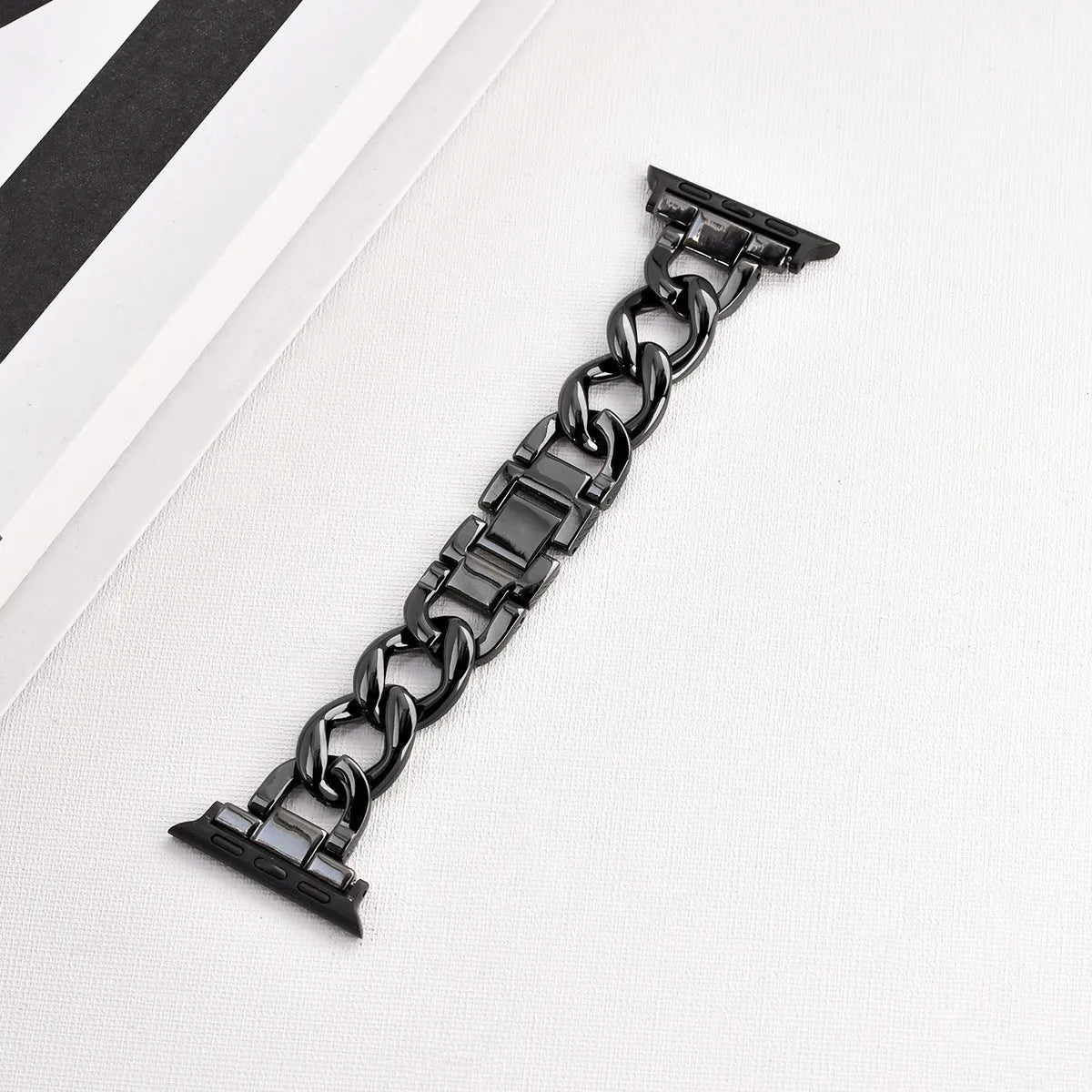 Metal denim chain watch strap for Apple Watch in multiple colours on a grey background.
