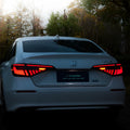 Black and red LED tail light assembly for 11th generation Honda Civic with sequential turn signals.