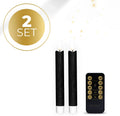 Set of four black LED taper candles with glowing 3D flame effect.