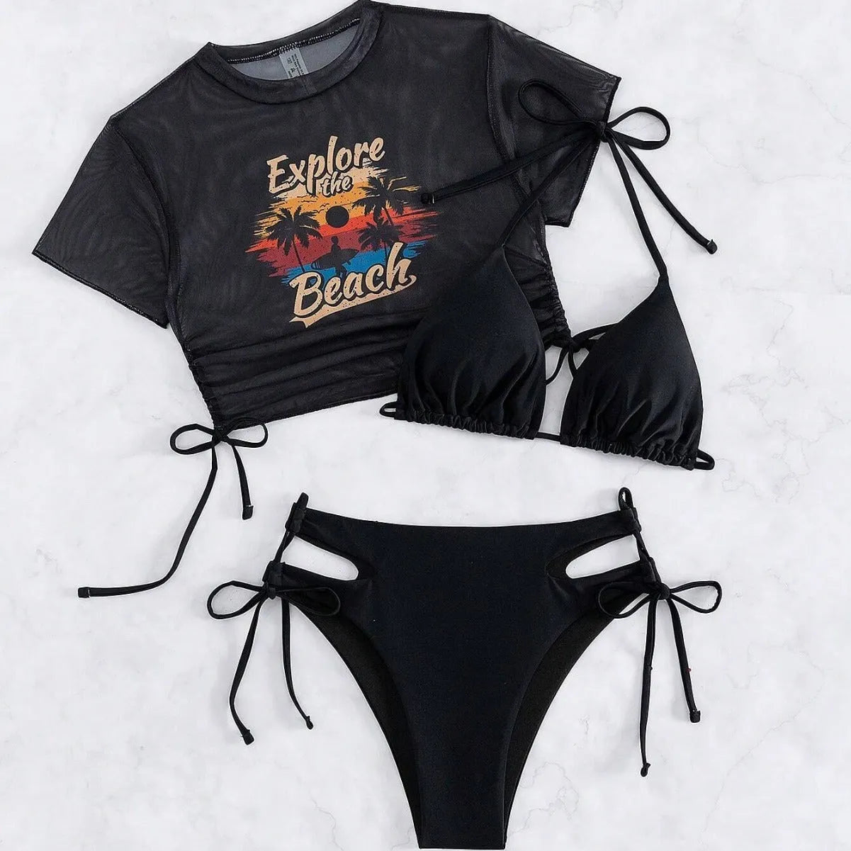 Women's three piece bikini swimsuit set in black, including bra, bottoms, and a short sleeved cover-up top.