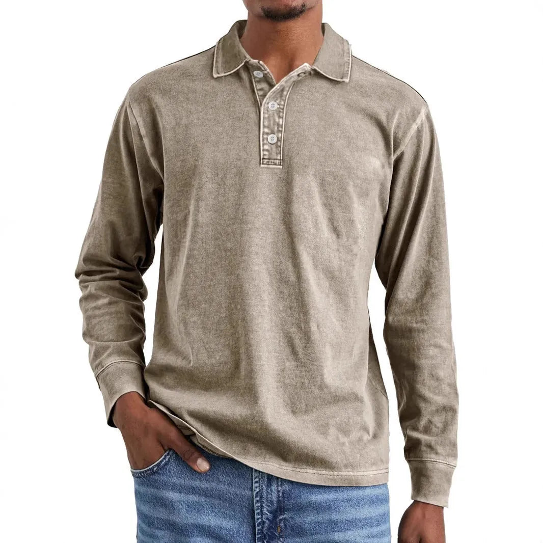 Man wearing a retro washed army green long sleeve polo shirt with a distressed lapel.