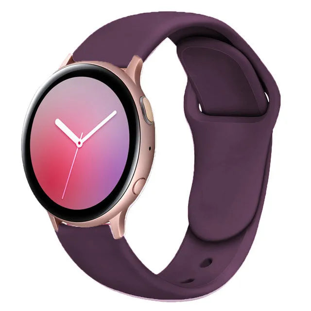 Samsung Galaxy Active 2 watch with a purple reverse buckle silicone strap on a wrist.