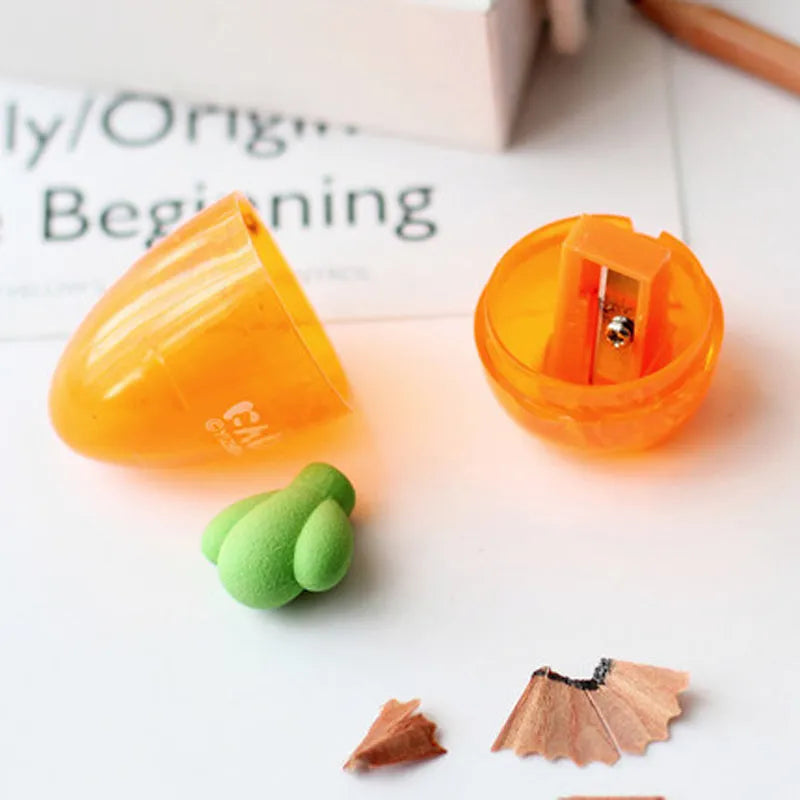 Carrot-shaped plastic pencil sharpener showing colourful design and 7cm length measurement