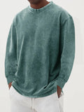 Men's washed old solid colour long-sleeved slim fit T-shirt on a hanger.