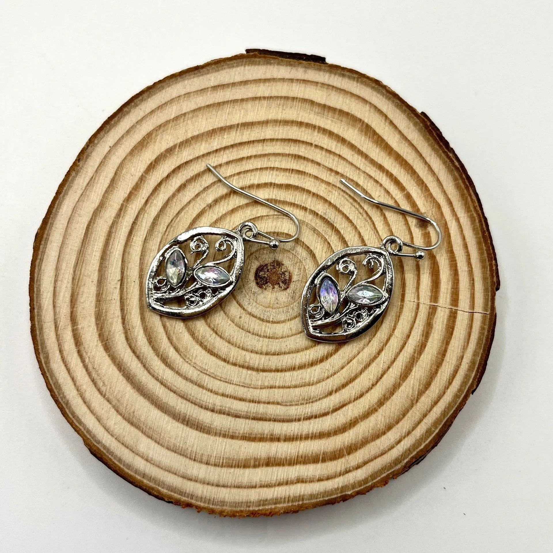 Silver colour leaf-shaped earrings with embedded colourful moonstones for women