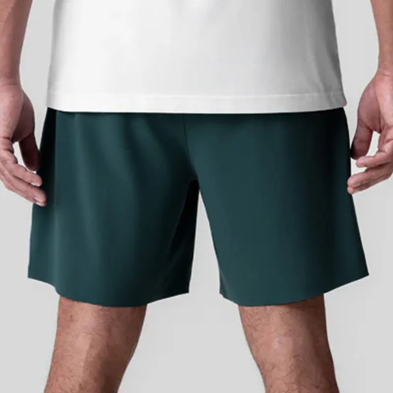 Men's grey seamless sports shorts with a straight leg and knee-length cut for summer athletics.