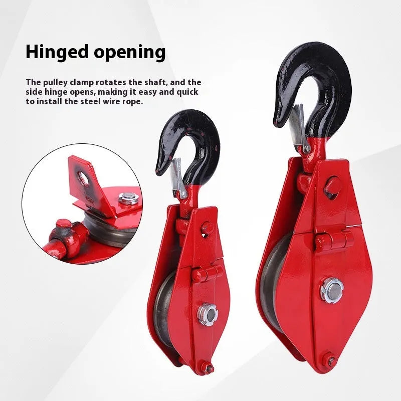 Red industrial single sheave lifting pulley with a safety latch on the steel hook.