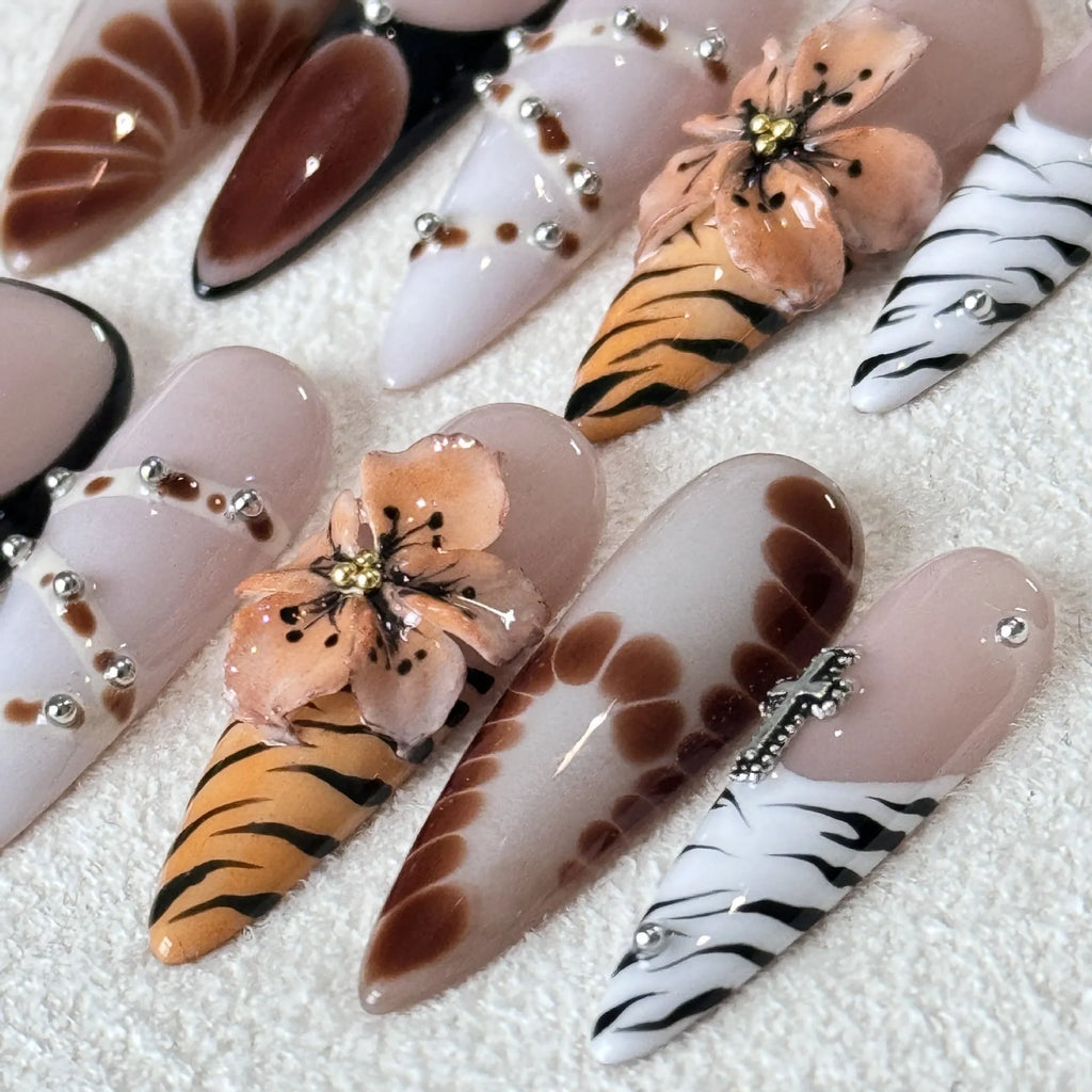 Handmade French style nail stickers with leopard print, cross, and floral patterns in four sizes