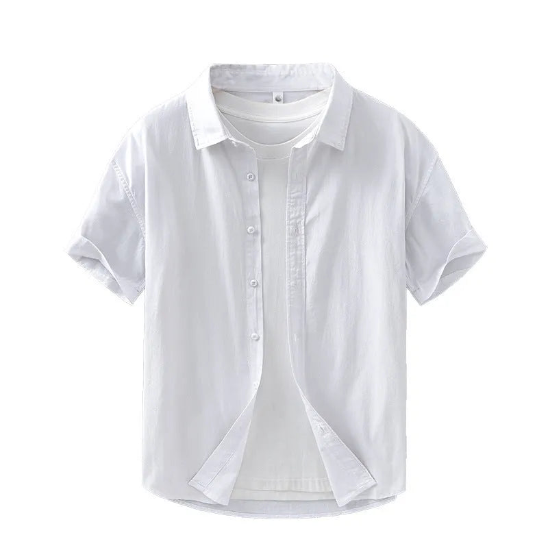 Man wearing a light grey loose-fit short-sleeved cotton shirt in a cardigan style.