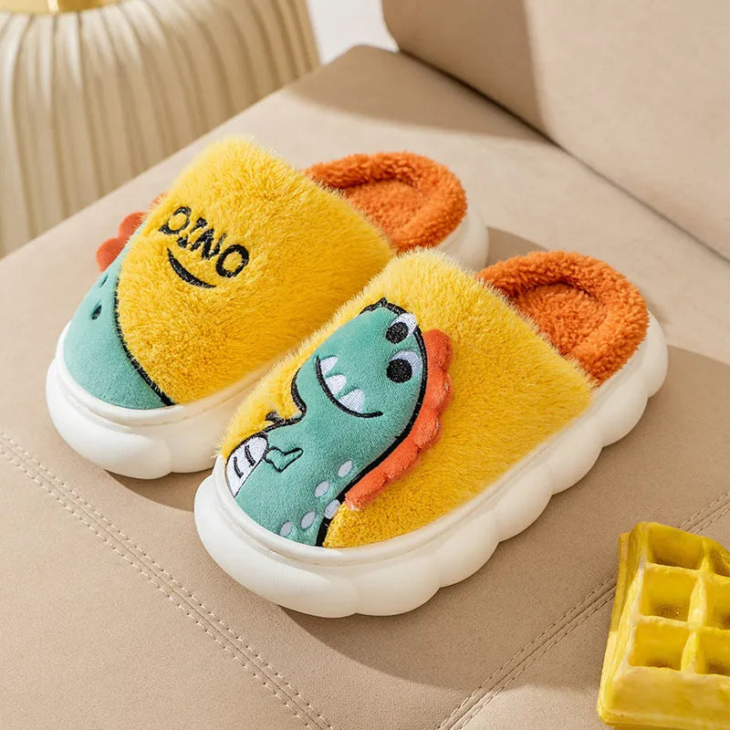 A pair of plush cotton couple slippers with a dinosaur design in a choice of three colours.