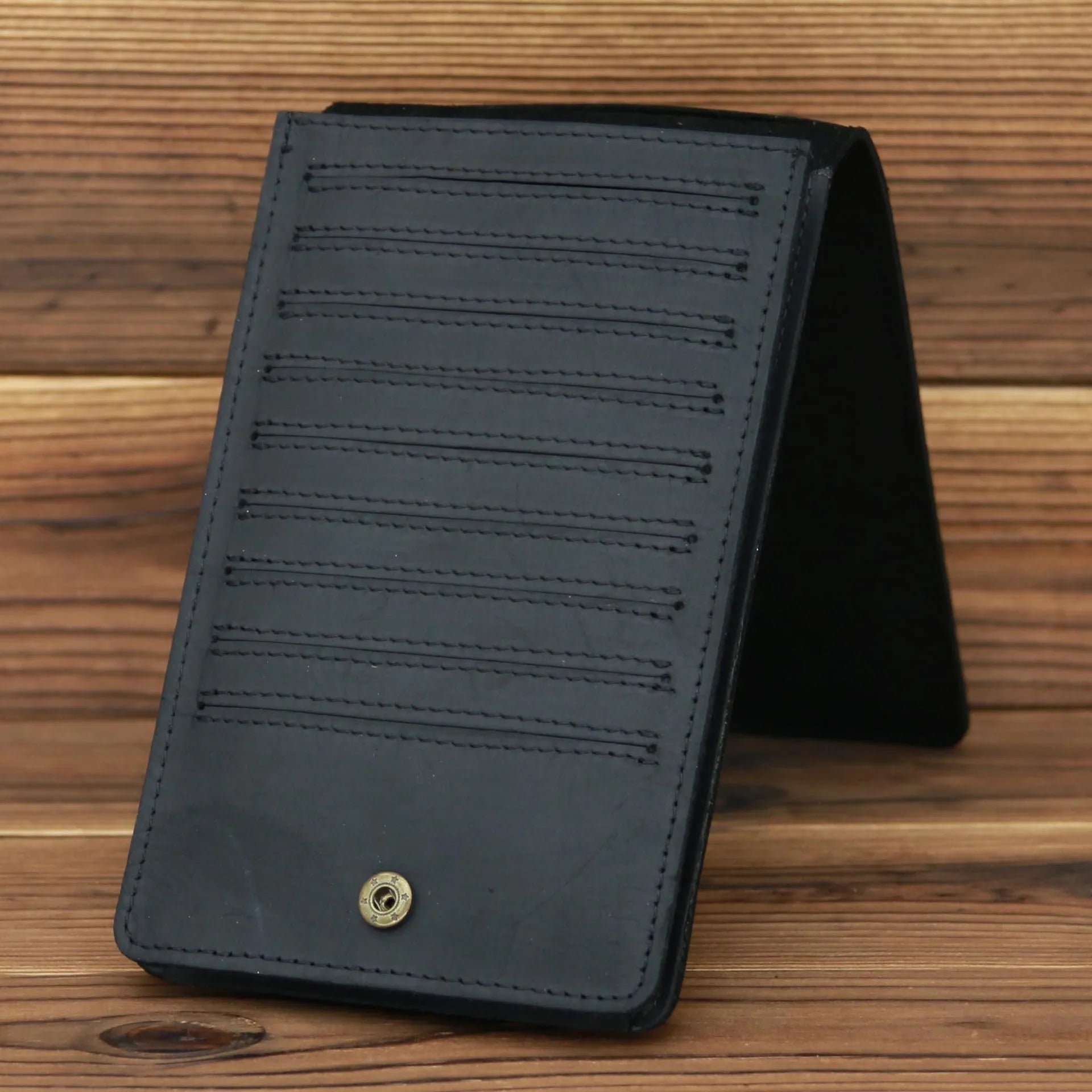 Men's slim leather card holder wallet with multiple card slots and a mobile phone pocket.