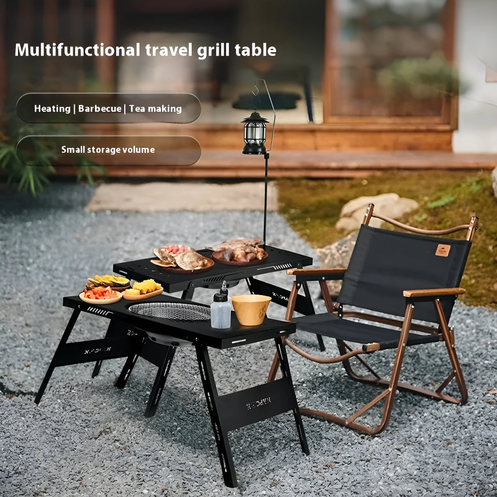 Folding camping cooking table with integrated barbecue surface in black
