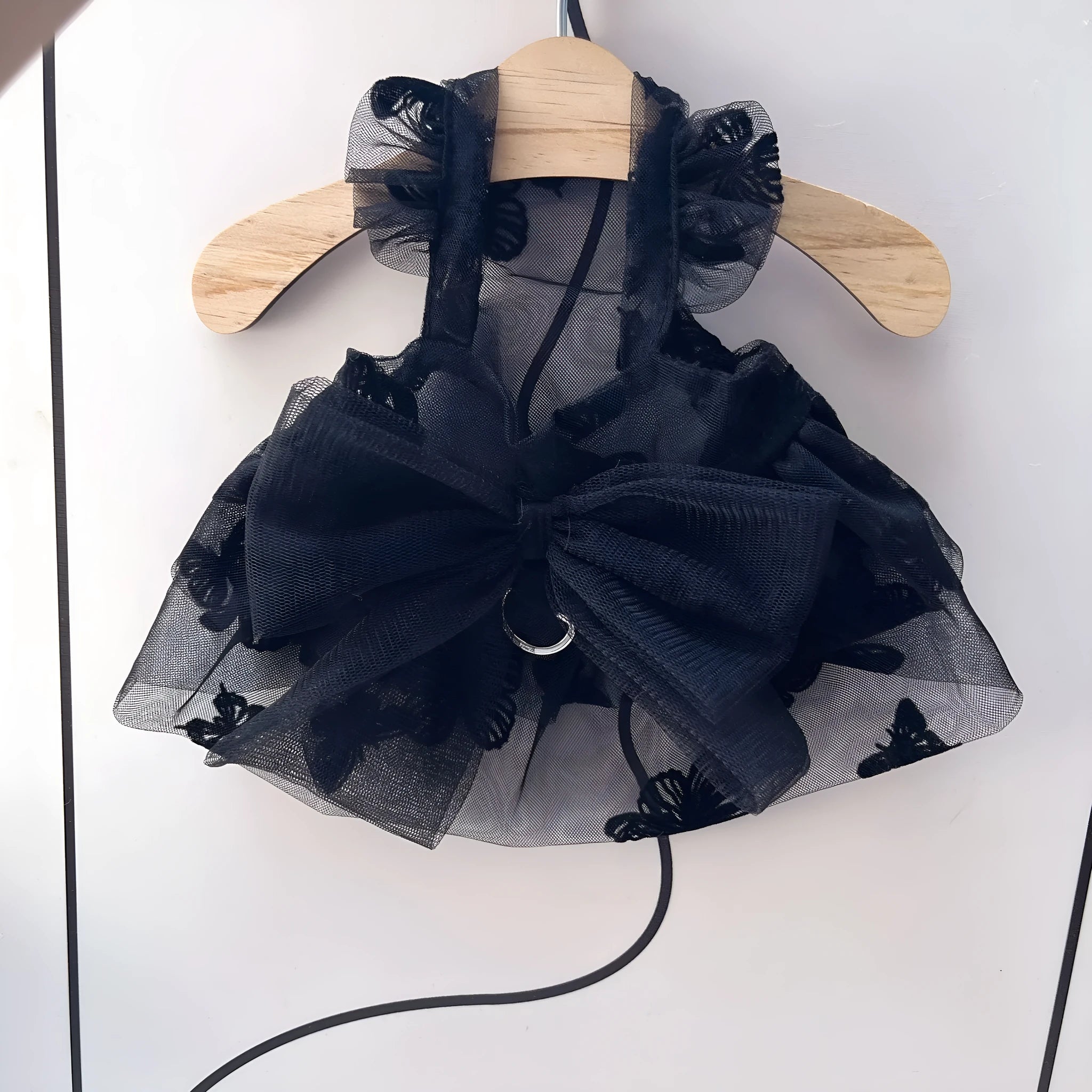 Black layered tulle princess skirt on a small dog, showing chest fit and back length.