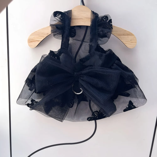 Black layered tulle princess skirt on a small dog, showing chest fit and back length.