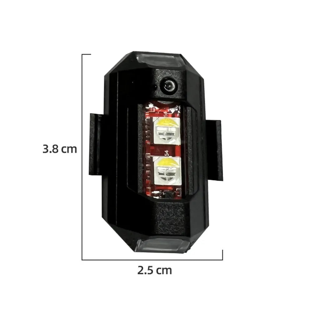 Drone strobe signal light with RGB LEDs next to Type-C charging cable and roll of mounting tape.