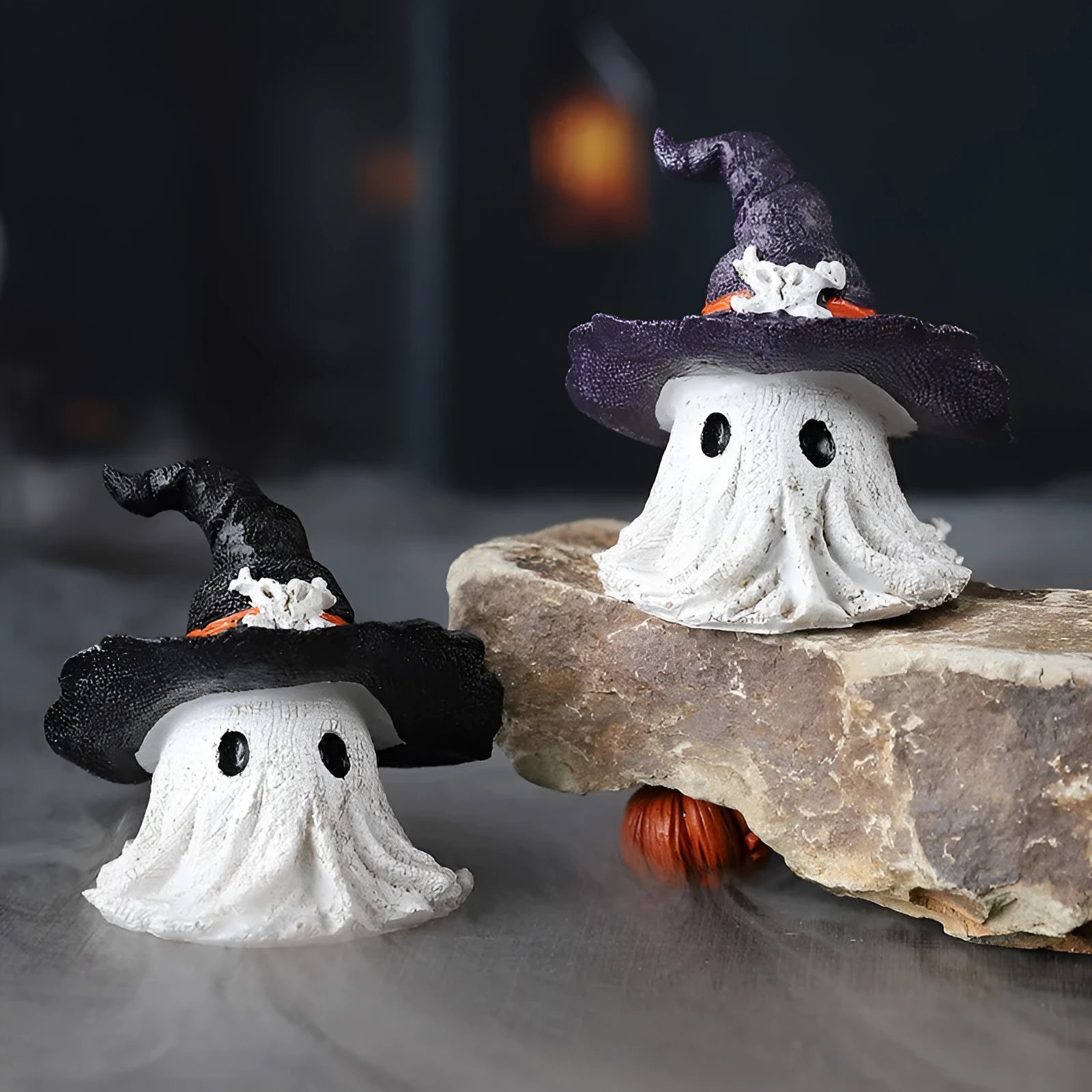 Resin wizard hat holiday ornament in purple and black colour options.