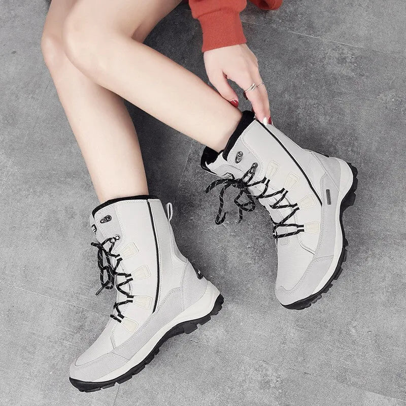 Women's black thermal snow boots with genuine leather uppers and a non-slip rubber sole.