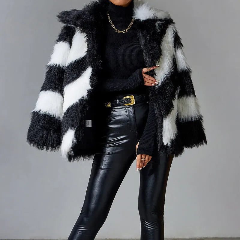 Women's faux fur coat with contrast lapel and detachable fur collar on a hanger.