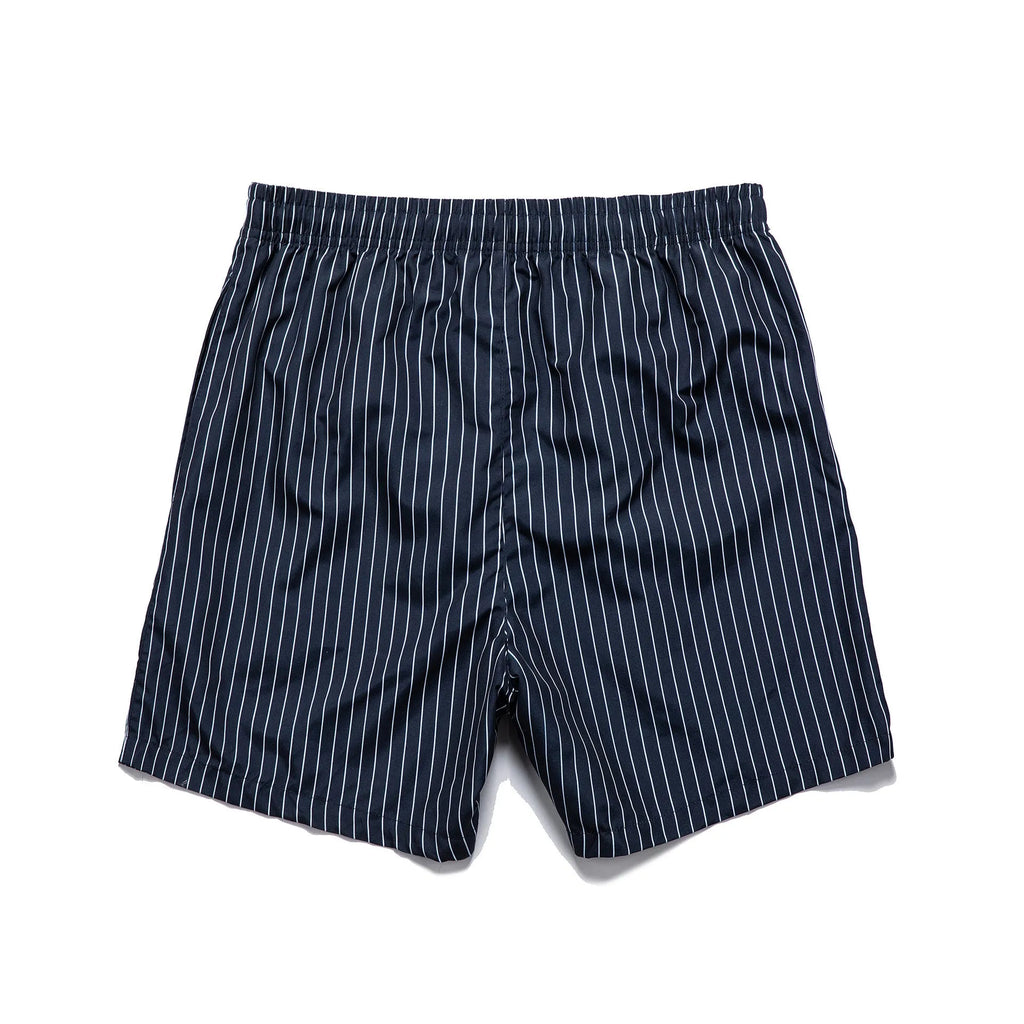 Polyester fibre beach shorts with striped triangle lining in straight leg design