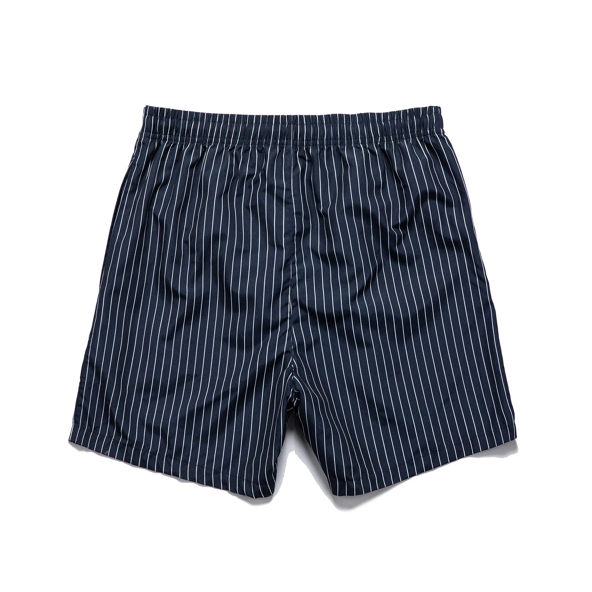 Polyester fibre beach shorts with striped triangle lining in straight leg design