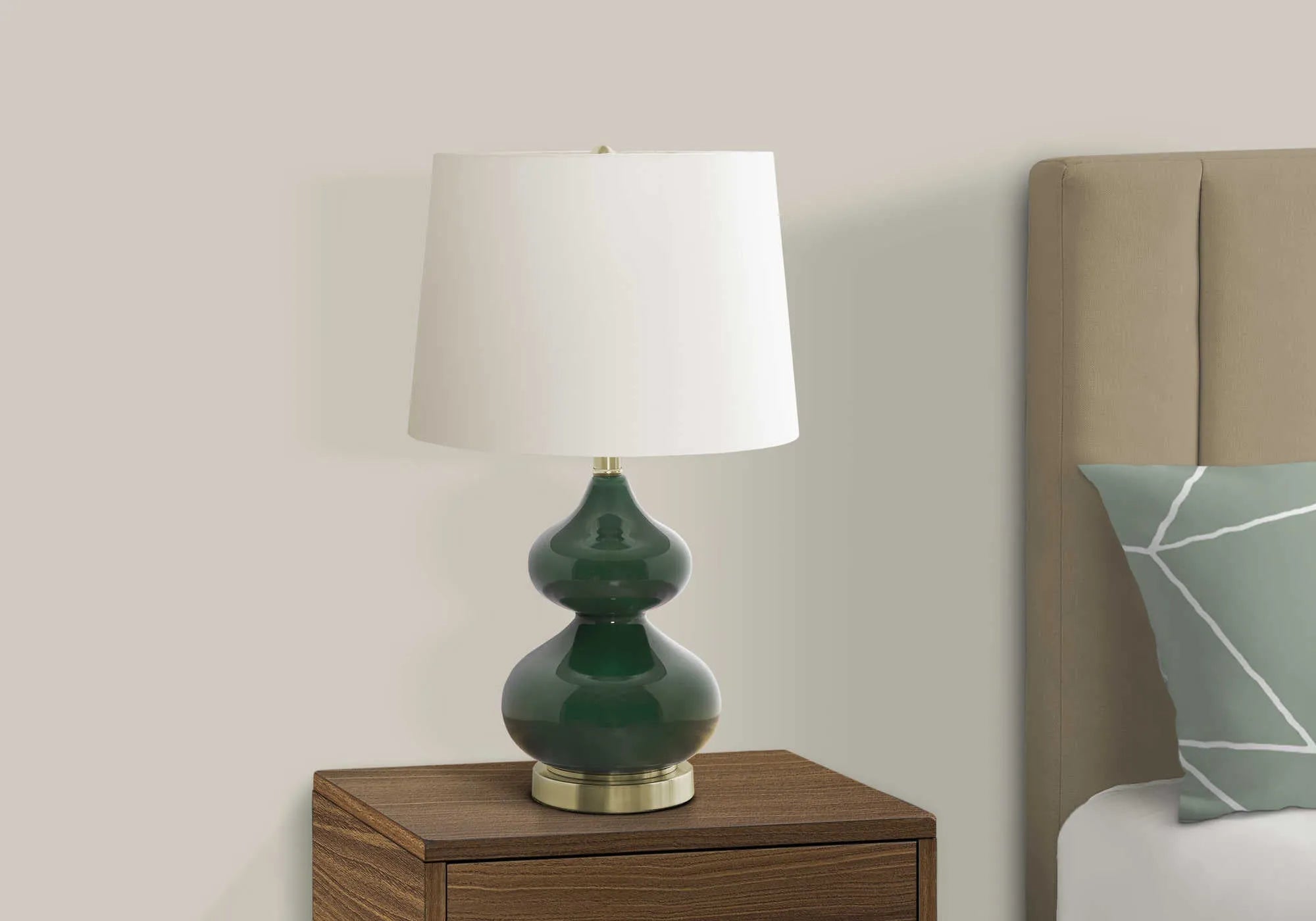 Tall crystal glass desk lamp with a blue cloth shade on a wooden desk.