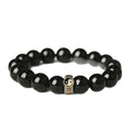 Black stone single ring bracelet for men and women on a wrist, showing 10mm and 12mm size options.