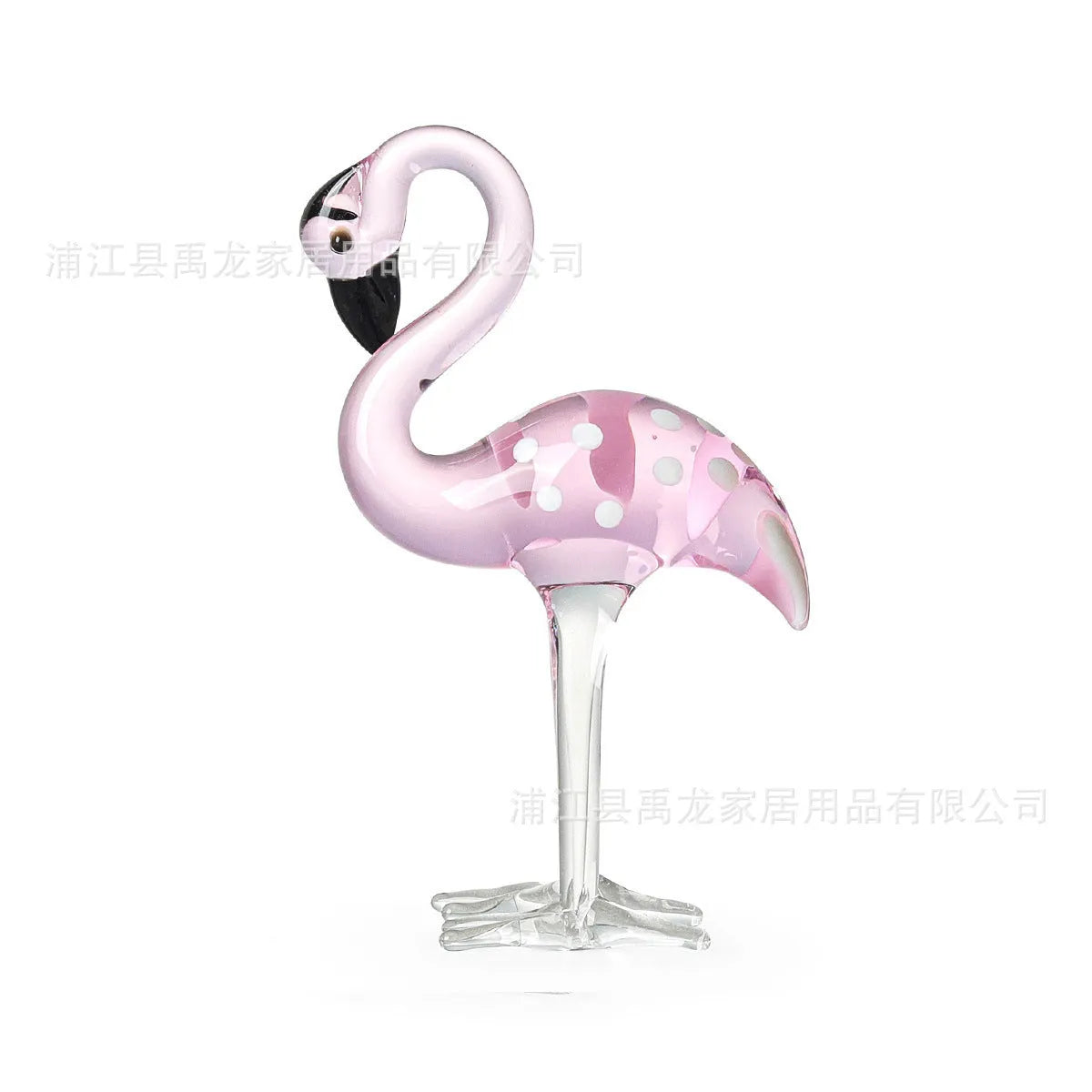 Pink flamingo crystal decorative ornament on a table in modern minimalist style.