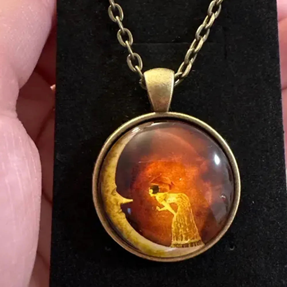 Retro moon-shaped organic glass pendant necklace on adjustable alloy cross chain in bronze finish