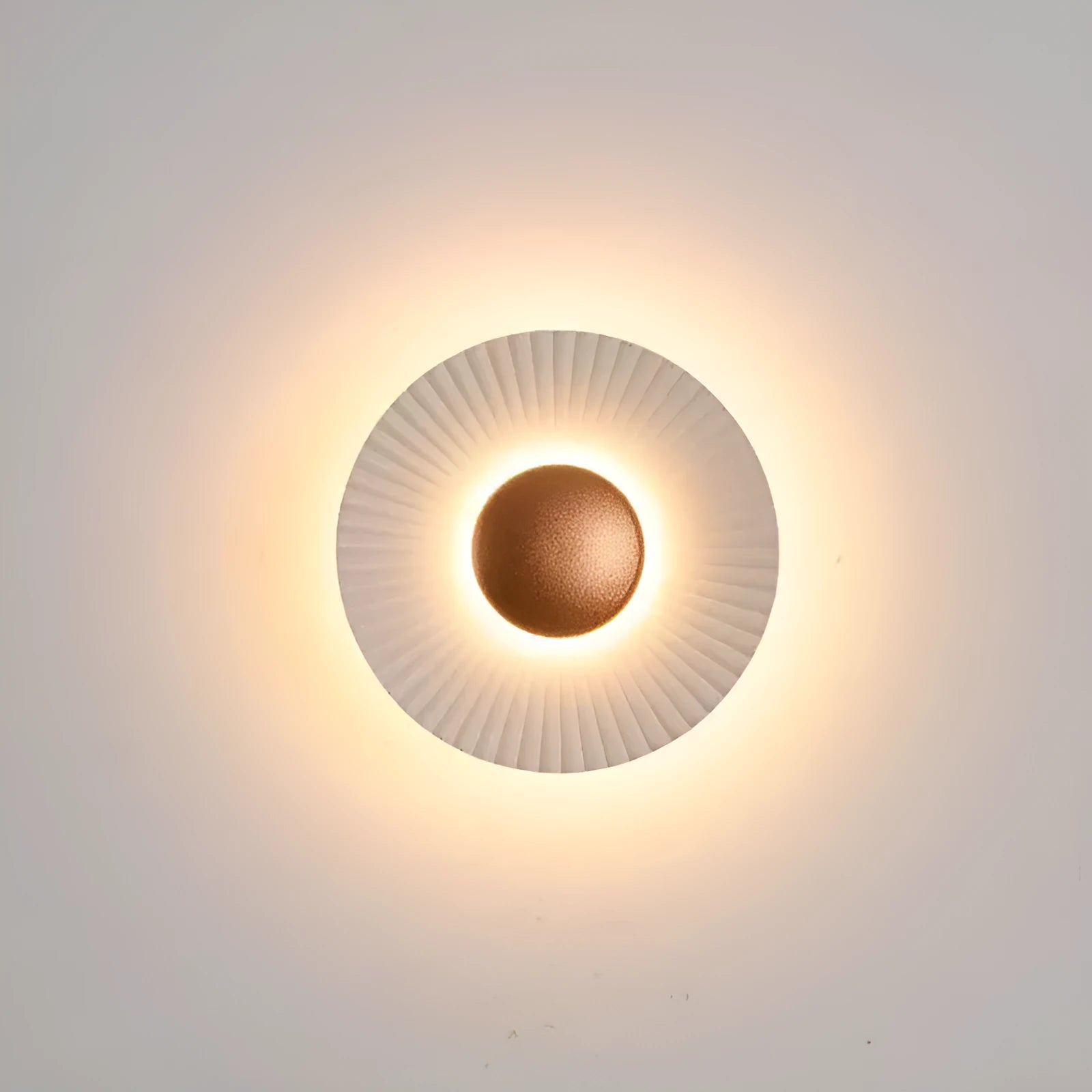 Round wall-mounted LED light with aluminium shade in a gold and white two-tone colour option.