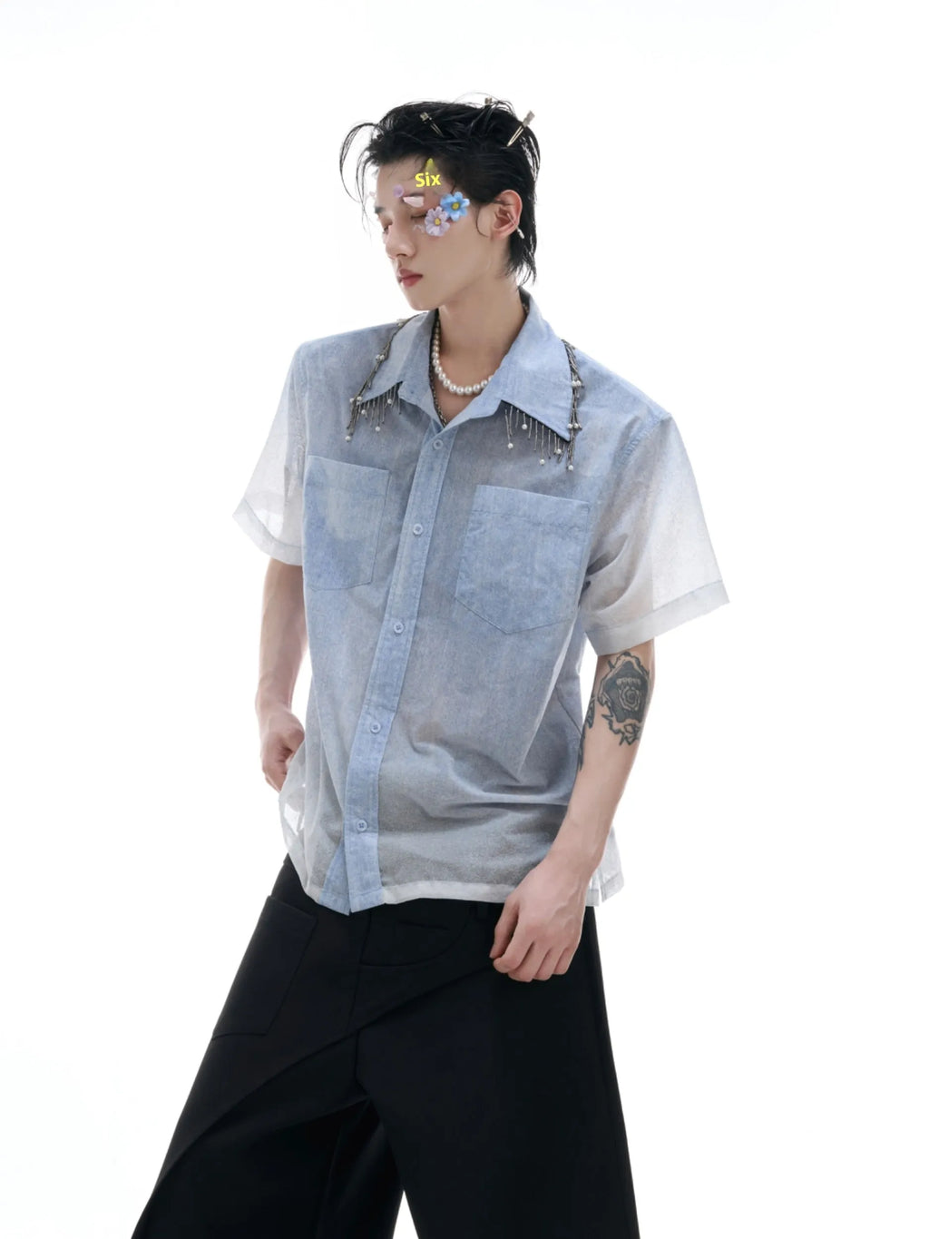 Blue and white gradient short-sleeved loose-fit shirt on a hanger.