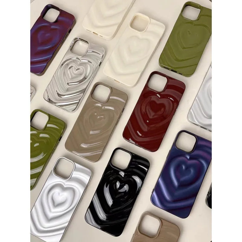 Solid colour iPhone case with a three-dimensional raised heart design on a glass back with TPU bumper.