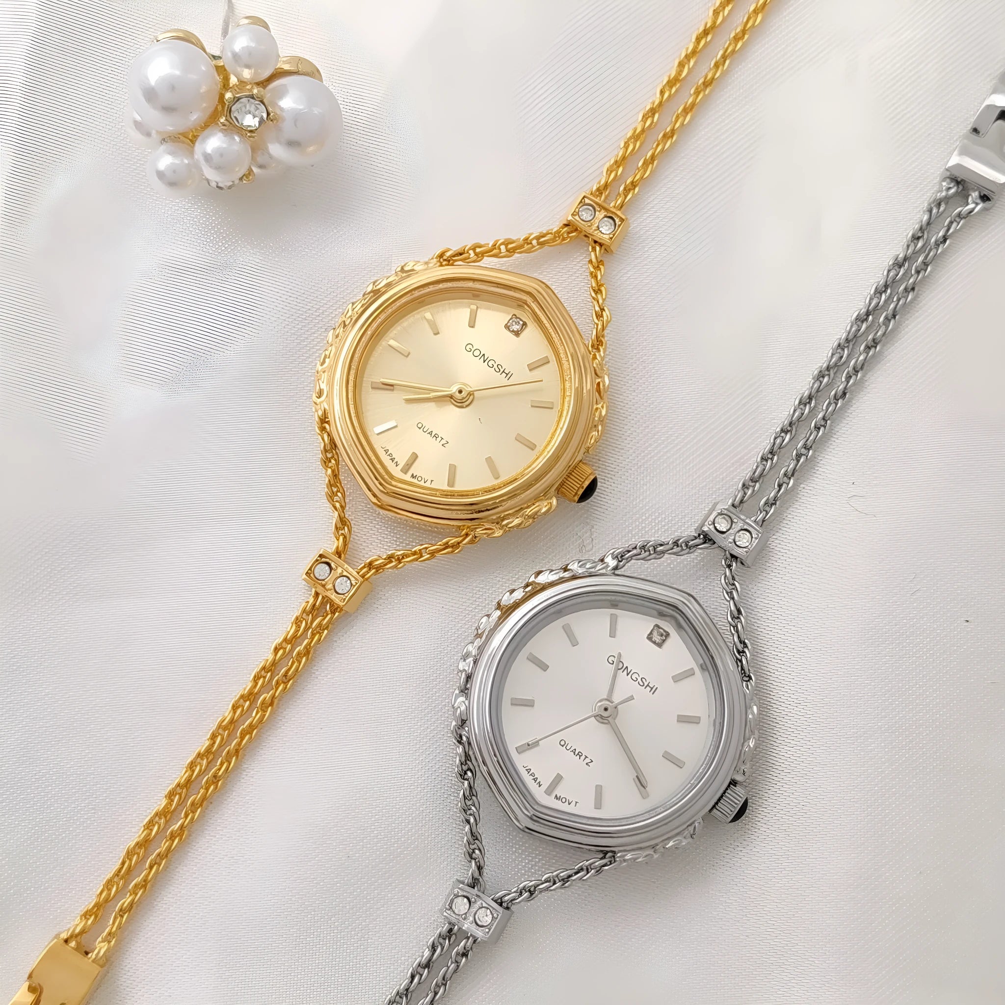 Gold and silver women's quartz watch with 25mm dial on a metal chain strap