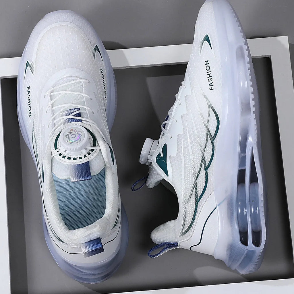White men's casual running shoes with a rotating button closure and mesh upper on a flat rubber sole.