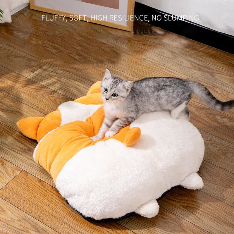 Orange semi-closed cat sleeping bag bed showing soft nest construction and raised edges.