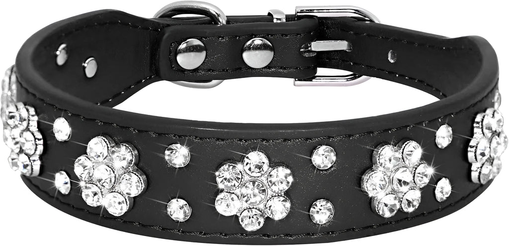 A decorative black PU leather dog collar with a sparkling rhinestone flower pattern and silver metal studs, shown adjusted with a metal D-ring.