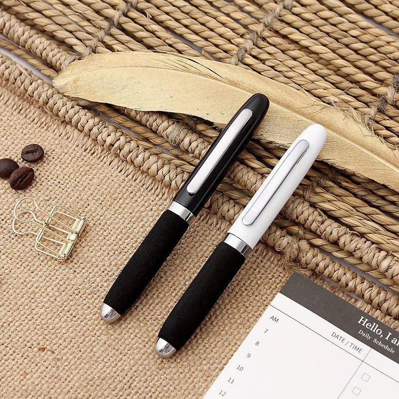 Silver EVA metal cap ballpoint pen with a 1.0mm tip on a notepad.